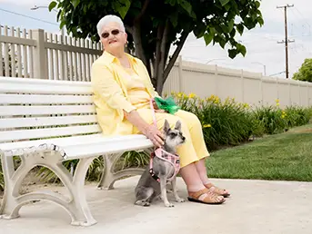 Woman with her dog at the pet park