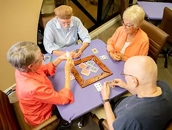 Friends playing a game of Mah Jongg